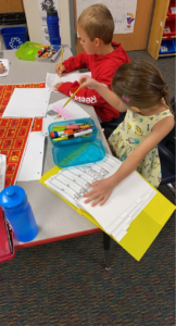 Kids Writing in Decoding Dictionaries